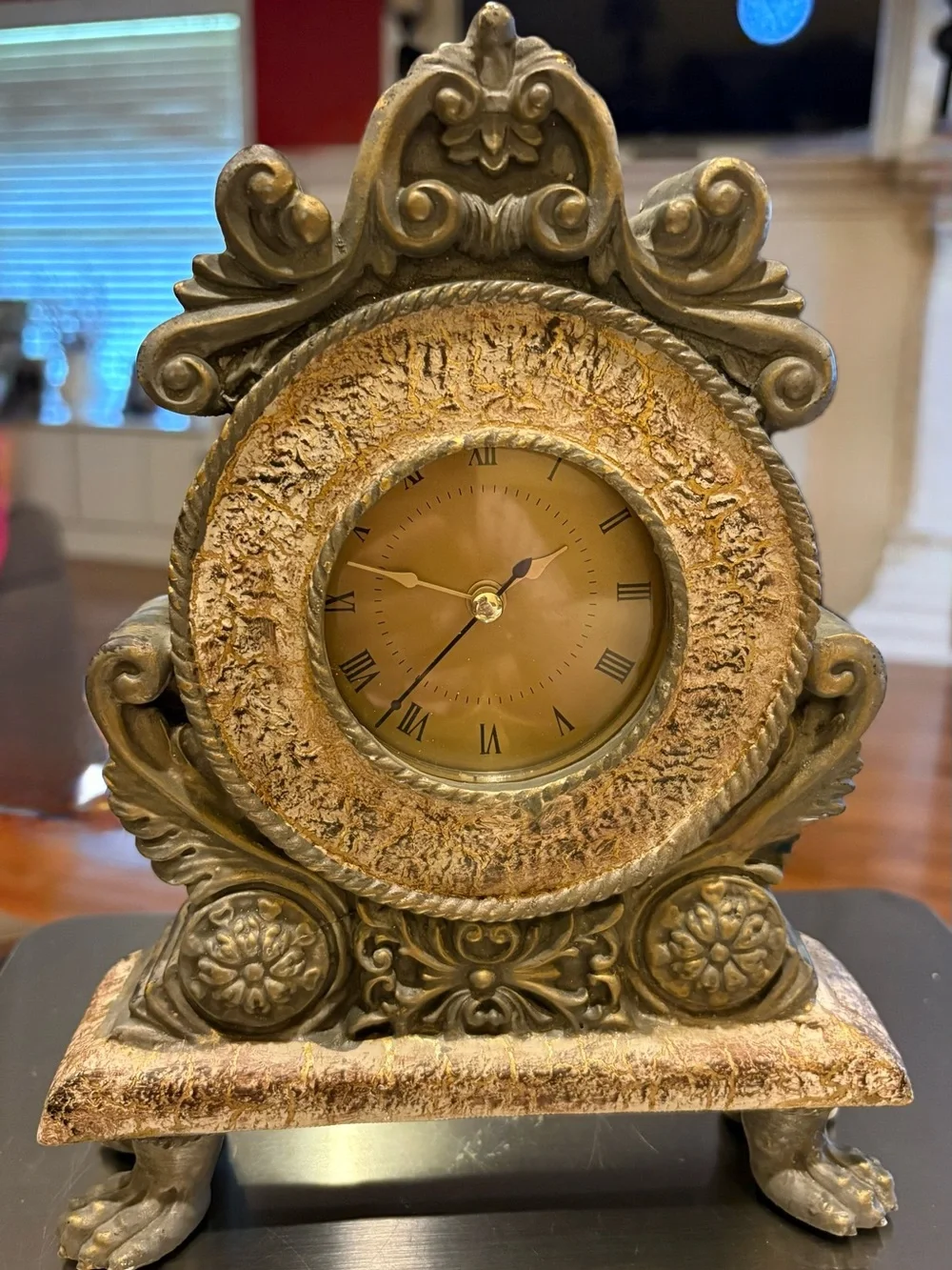 Vintage baroque style mantel clock, aged gold or brass finished Resin frame.
